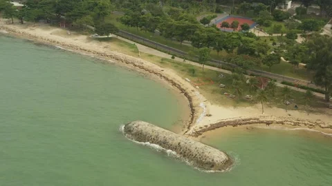 Aerial shot of trash &amp; garbage on beach ,East Coast Park, Singapore Stock Footage 137280595
