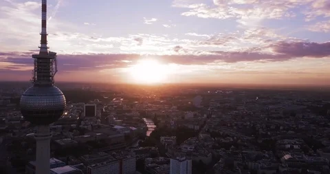 Aerial Shot of the TV Tower in Berlin. Circling Tower in a City with Pink Sky Stock Footage