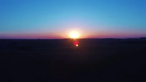 Aerial shot. twilight, sunrise in field Stock Footage