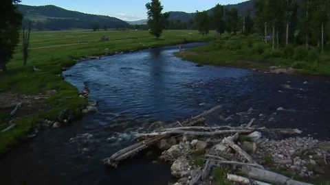 Aerial shot of two fly fisherman Stock Footage