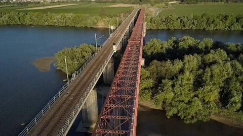 Aerial shot of two parallel bridges over a river Stock-Footage 104524759