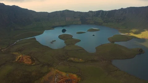 Aerial shot from under the cloud. View on caldera lakes of Corvo volcano, Azores Stock Footage 117306278