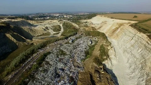 Aerial shot of vehicle bringing garbage to dump. Video stock 80978433