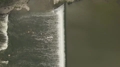 Aerial shot vertical look down river running across a city in a sunny day 2 Stock Footage 61135816