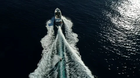 Aerial shot of wakeboarder being pulled along Stock Footage 123209054