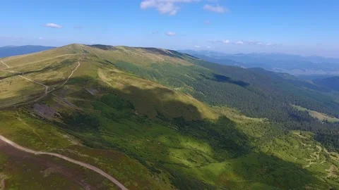 Aerial shot of the wall looking range of the Carpathian Mountains in summer. Stock Footage 86611394