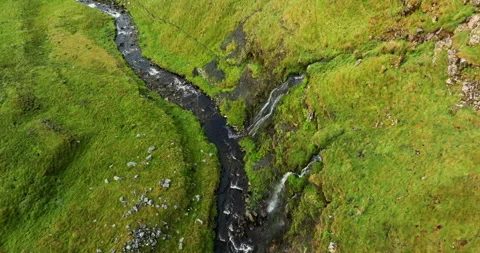 Aerial shot of waterfalls flowing into the river Stock Footage 312275053
