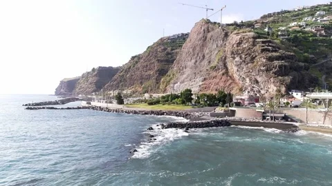 Aerial Shot of Waves Crashing and Mountain Seaside Stock Footage