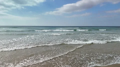 Aerial Shot of Waves Gliding Over a Beach, Day Time, Perranporth, Cornwall Stock Footage 310128393