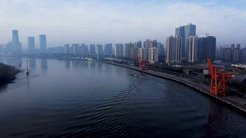 A aerial shot of the West Bund Water Front in Shanghai China during the morning Stock Footage 128406853