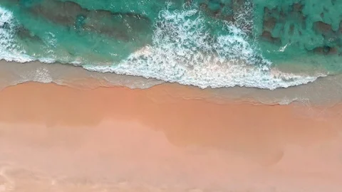 Aerial shot of white sand beach and turquoise ocean water in Oman, near Salalah Stock Footage 108421018