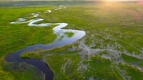 Aerial Shot of Winding River Sunset Grassland Plain in Inner Mongolia China Video stock 337948443