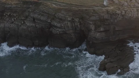 Aerial Shot of winter waves breaking on the cliffs Stock Footage 126353636