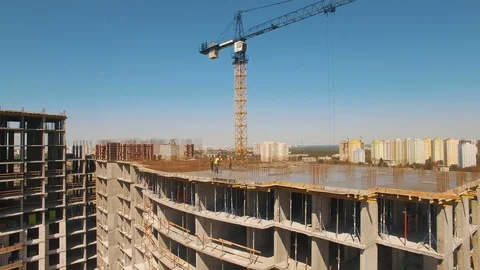 Aerial shot of workers in a construction, structure in the process to be build Stock Footage 91889988