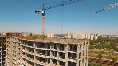 Aerial shot of workers in a construction, structure in the process to be build Stock Footage 91892449