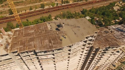 Aerial shot of workers in a construction, structure in the process to be build Stock Footage 91896421