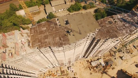 Aerial shot of workers in a construction, structure in the process to be build Stock Footage 91898375
