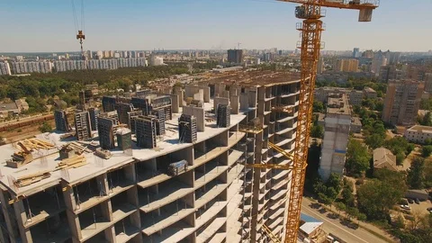 Aerial shot of workers in a construction, structure in the process to be build Stock Footage 92988294