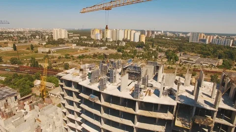 Aerial shot of workers in a construction, structure in the process to be build Stock Footage 92994013