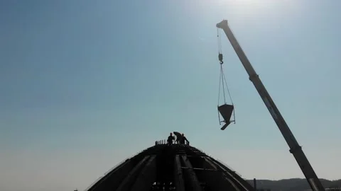 Aerial shot of workers in a construction, structure in the process to be build Stock Footage 142893947