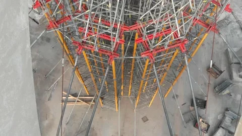 Aerial shot of workers in a construction, structure in the process to be build Stock Footage 142897918