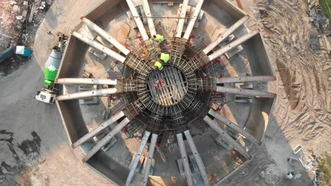 Aerial shot of workers in a construction, structure in the process to be build Stock Footage 142901199