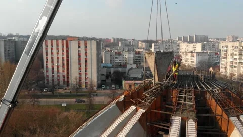 Aerial shot of workers in a construction, structure in the process to be build Stock Footage 142901684