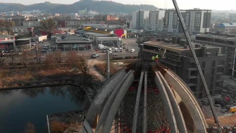 Aerial shot of workers in a construction, structure in the process to be build Stock Footage 142902017