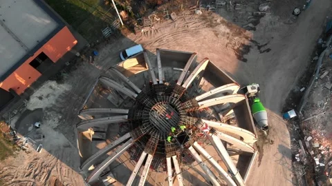 Aerial shot of workers in a construction, structure in the process to be build Stock Footage 142903233