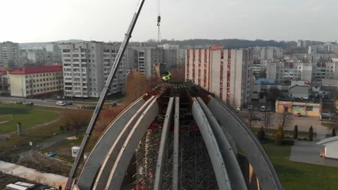 Aerial shot of workers in a construction, structure in the process to be build Stock Footage 142903347