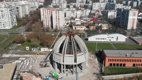 Aerial shot of workers in a construction, structure in the process to be build Stock Footage 142906126