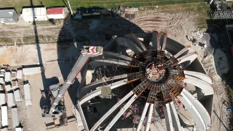 Aerial shot of workers in a construction, structure in the process to be build Stock Footage 142906719