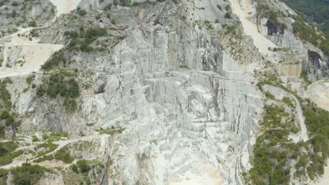 Aerial shot of a working marble quarry in the mountains of Carrara, Italy Stock Footage 248731117