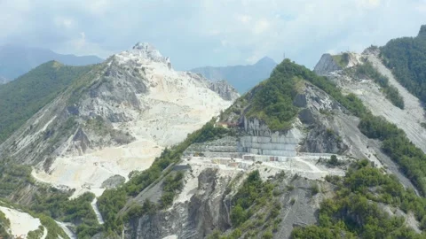 Aerial shot of the world's largest active marble quarry in Carrara, Italy Stock Footage 248715974
