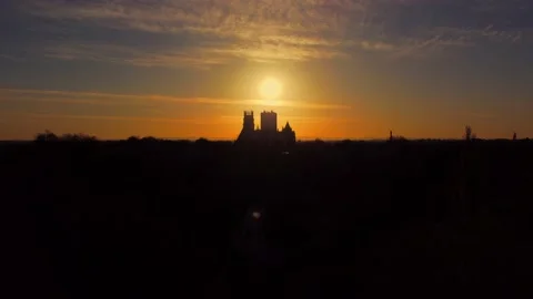Aerial shot of York skyline with York Minster silhouette at sunrise Stock Footage