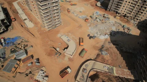 Aerial shot.Construction from top point.  Construction materials trucks Stock Footage 45595755