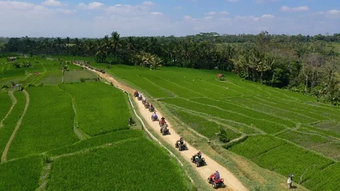 Aerial Shots of Driving ATV's through Southeast AsianTowns Stock Footage 125160953