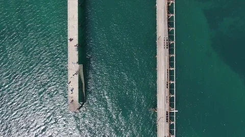 Aerial shots, top down view of Rapid Bay Jetty. Some shots contain fisherman. Stock Footage 104584276