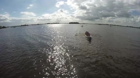 Aerial showing front of a rowing crew lady team finishing the competition 4k Stock Footage 54928222
