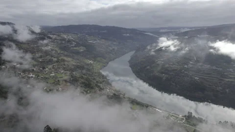 Aerial shpt over the Douro river in a foggy morning Stock Footage 237338873