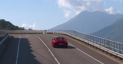 Aerial Side Angle Red Convertible Speeding on Road Stock Footage 159665485