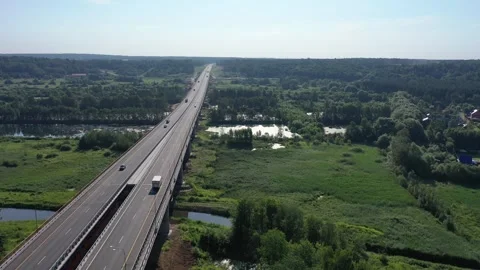 Aerial side angle view of rising drone over bridge Stock Footage 321641975