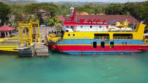 Aerial side drone view of docking ferry. Ferry transports cars, motorcycles Vídeo Stock 234617579
