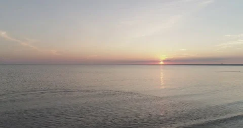 Aerial side fly over baltic sea in sunset time Stock Footage