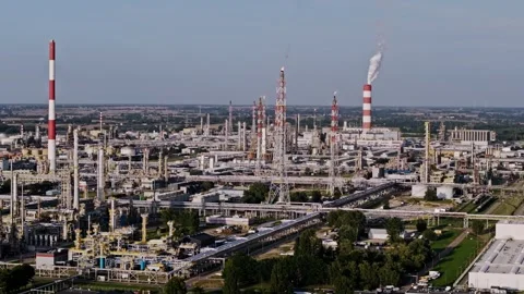 Aerial Side Motion Over Oil Refinery with Chimneys and Industrial Landscape Stock Footage 335951457