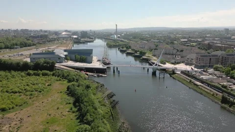Aerial side on pullback of Riverside Museum and Swivelly Bridge with Glasgow Stock-Footage 314720153