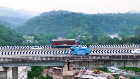 Aerial side tracking view of heavy Indian transport truck driving  Stock-Footage 346642479