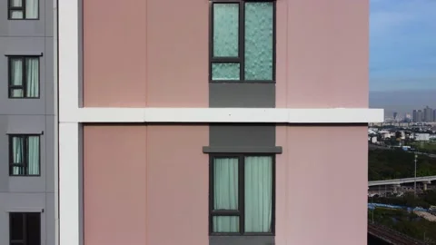 Aerial side view of built modern high-rise apartment building Stock Footage 226528983