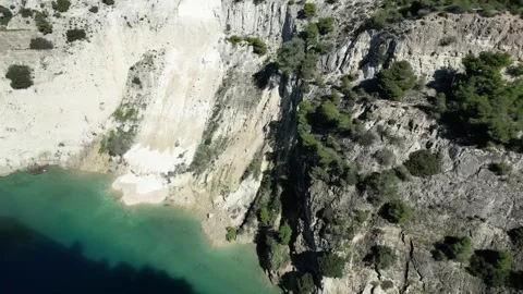 Aerial Side View of Corinth Canal Greece - Turquoise Water and High Cliffs - 4K Stock Footage 332064272