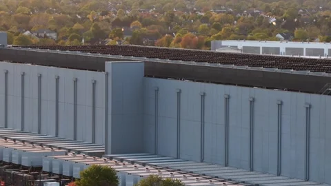Aerial side view of data center in Ashburn, Virginia showing massive industrial Stock Footage 333701285